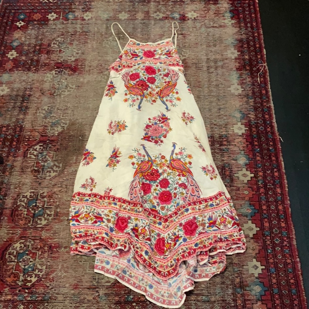Spell size medium handkerchief dress. Has a few small stains sold as is.